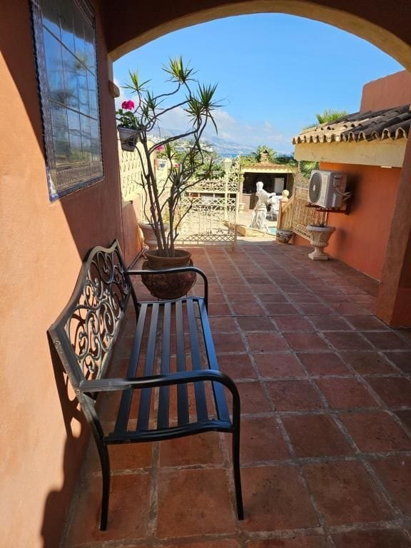 Covered terrace and entrance patio at Villa Andalucía Mijas