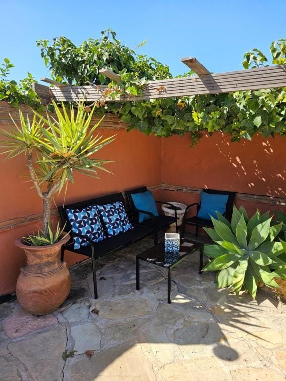 Shaded garden lounge corner at Villa Andalucía Mijas