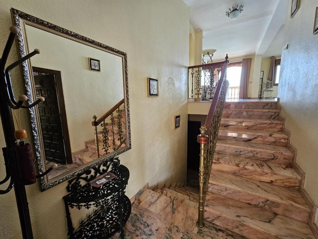 Marble staircase and interior hallway at Villa Andalucía