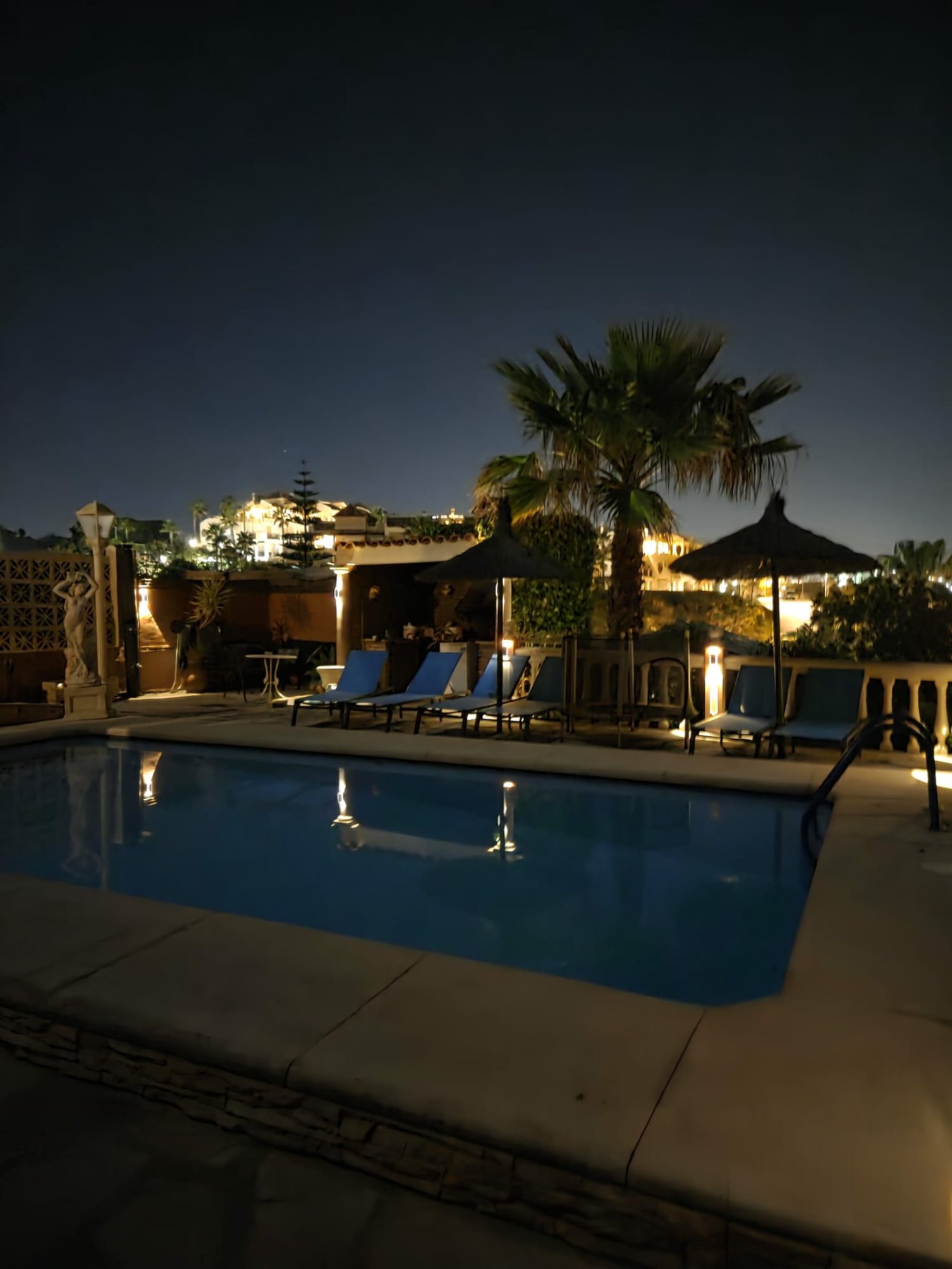 Private swimming pool by night at Villa Andalucía