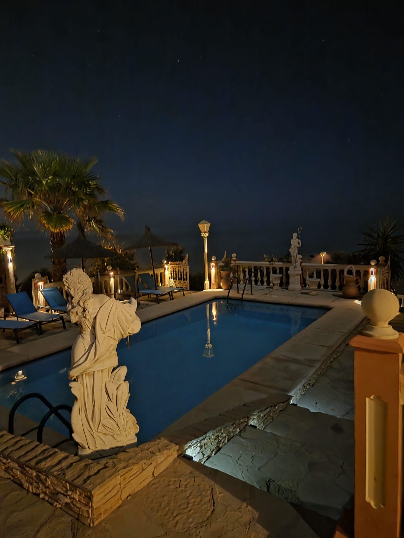 Villa Andalucía illuminated private pool at night in Mijas Costa
