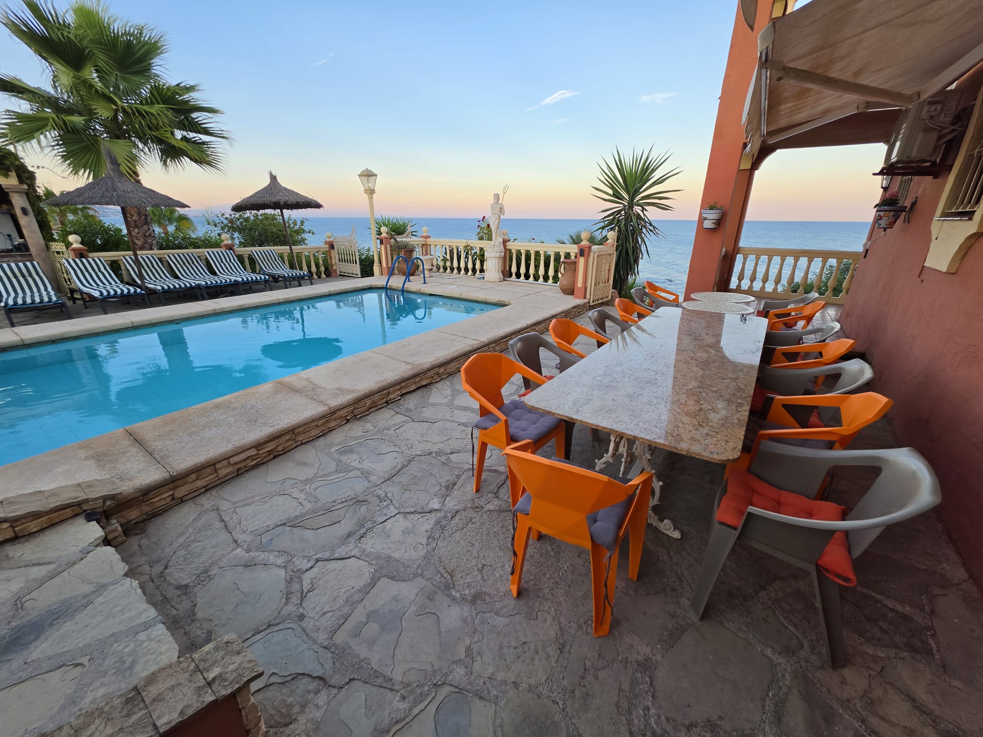 Outdoor dining beside the private pool
