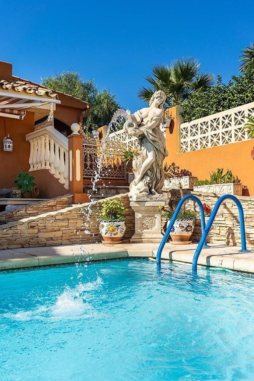 Private swimming pool with Neptune fountain at Villa Andalucía